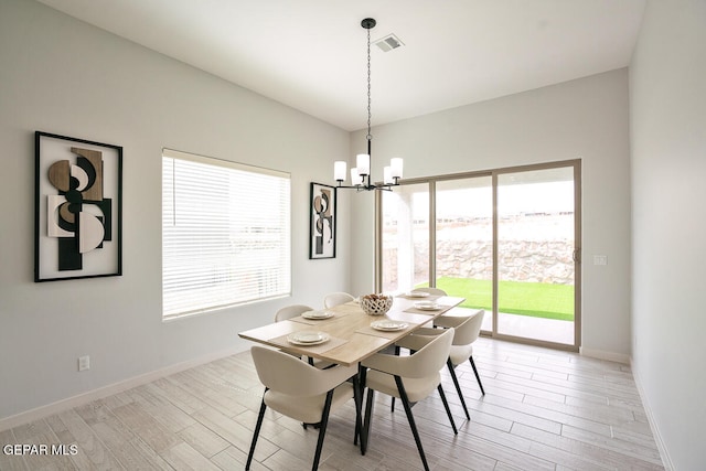 dining space featuring a chandelier