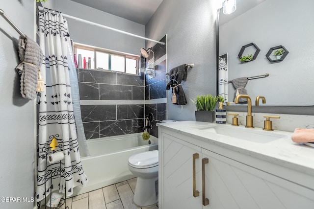 full bathroom with shower / tub combo with curtain, vanity, and toilet