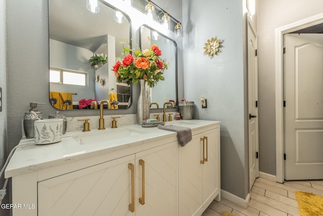 bathroom featuring vanity and wood-type flooring