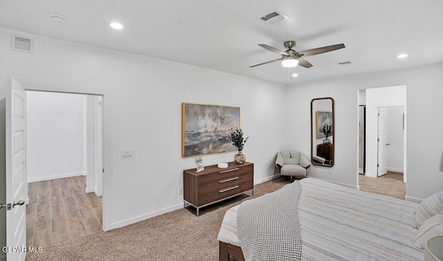 bedroom featuring light hardwood / wood-style floors and ceiling fan