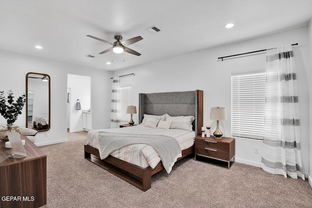 bedroom with ceiling fan and light carpet