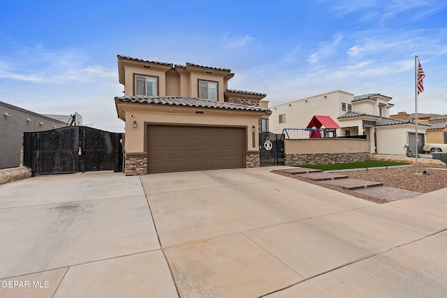 mediterranean / spanish house featuring a garage