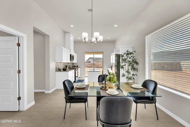 dining room featuring a chandelier and light hardwood / wood-style floors