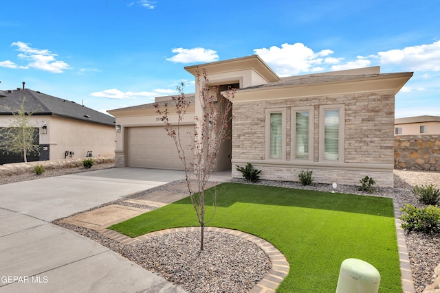 view of front of property featuring a garage and a front lawn