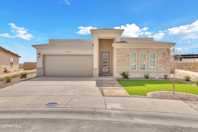 prairie-style house featuring a garage