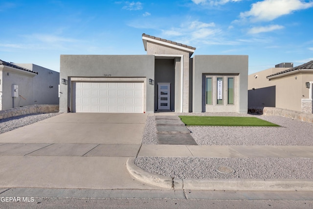 southwest-style home with a garage