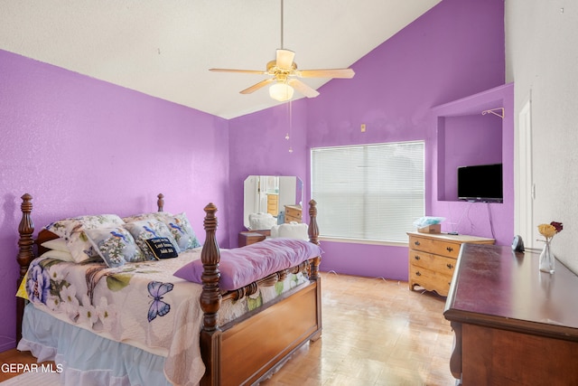 bedroom featuring light parquet floors, high vaulted ceiling, and ceiling fan