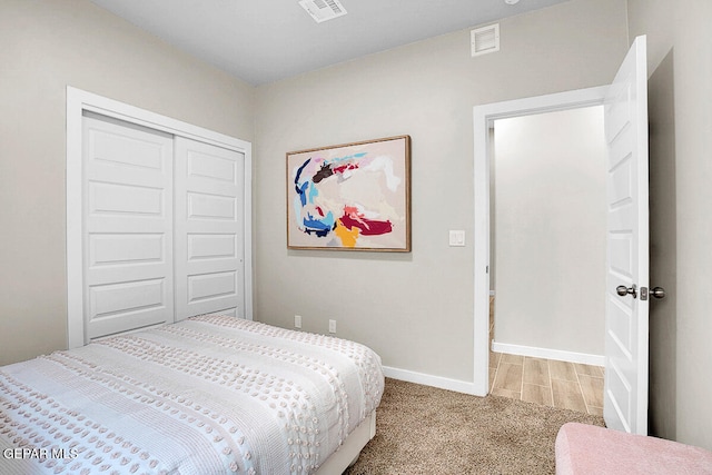 carpeted bedroom with a closet