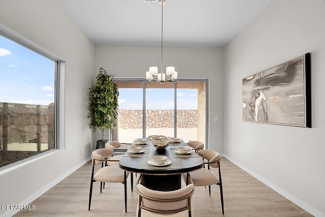 dining room with a notable chandelier