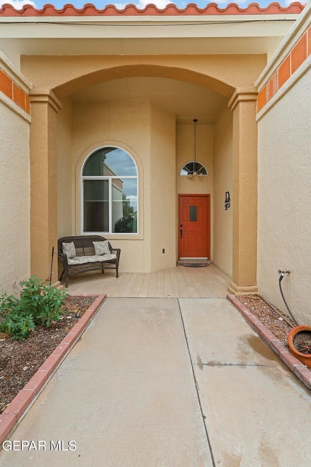 doorway to property featuring a patio area