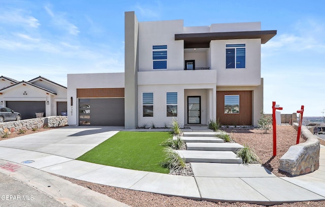 contemporary house with a balcony and a garage