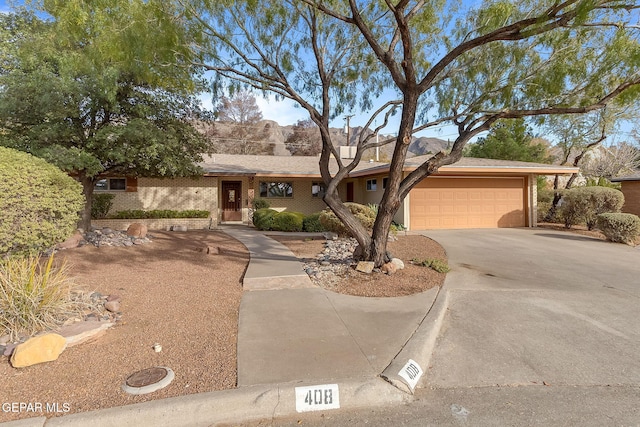 ranch-style house featuring a garage