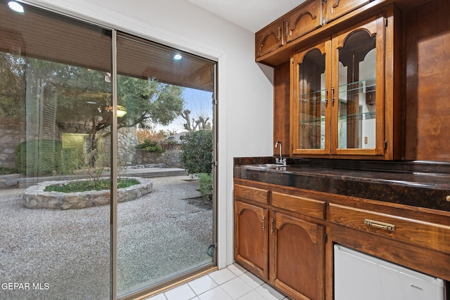 interior space featuring tile patterned floors and sink