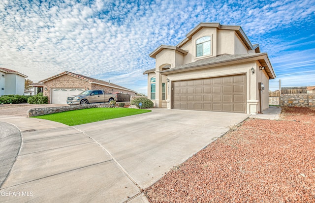 view of front of house featuring a front lawn and a garage