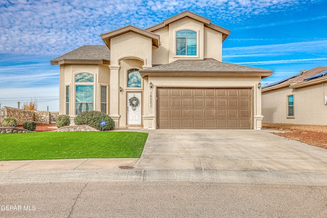 front of property featuring a garage and a front lawn