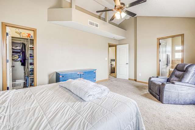 bedroom with carpet flooring, vaulted ceiling, ceiling fan, a spacious closet, and a closet