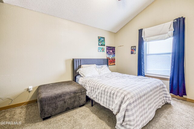 bedroom with carpet and vaulted ceiling