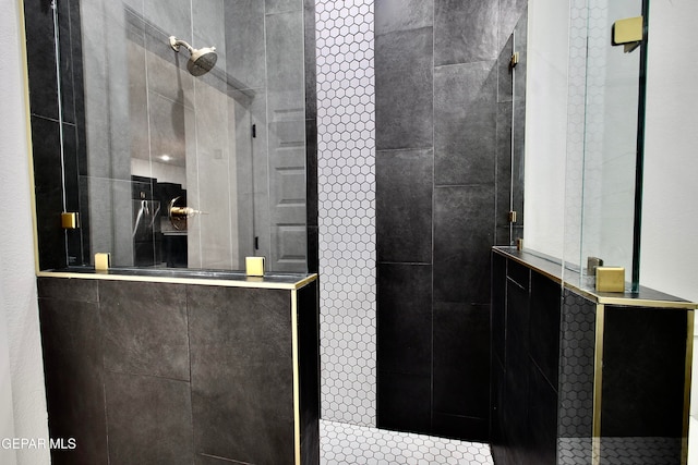 bathroom with a tile shower