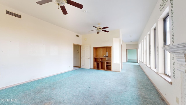 interior space featuring carpet and ceiling fan