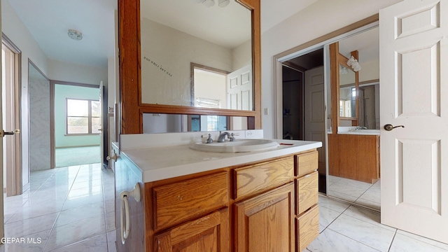 bathroom with vanity and tile patterned floors