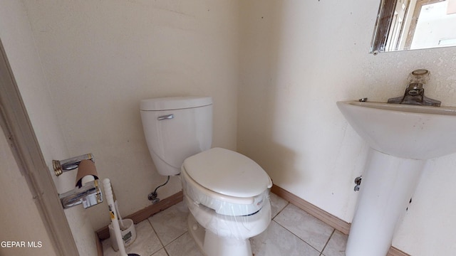 bathroom featuring tile patterned floors and toilet