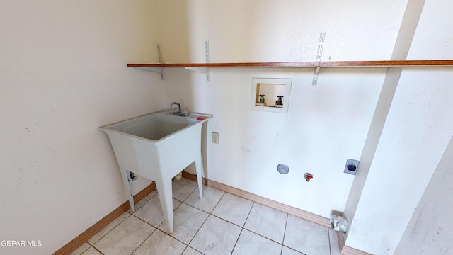 laundry room featuring hookup for an electric dryer, washer hookup, and light tile patterned flooring