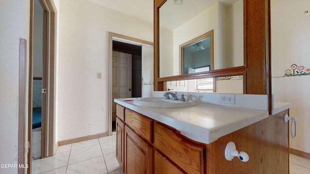 bathroom with tile patterned flooring and vanity