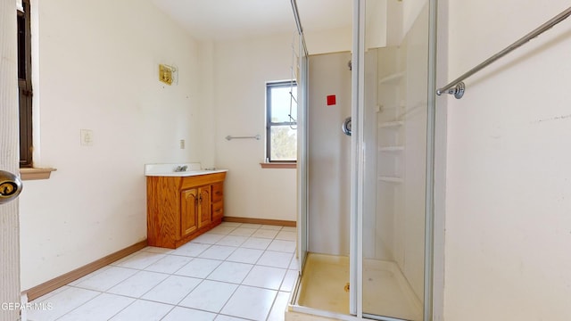 bathroom with tile patterned floors, vanity, and a shower with shower door