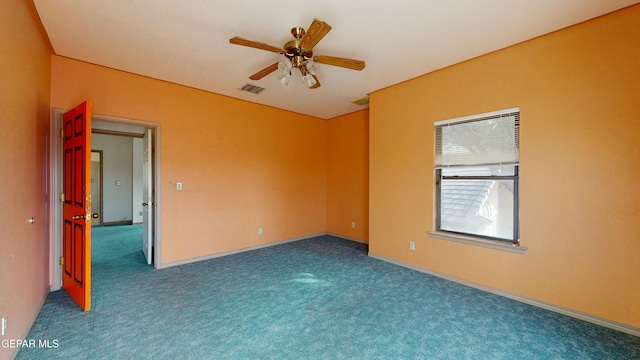 empty room with carpet flooring and ceiling fan