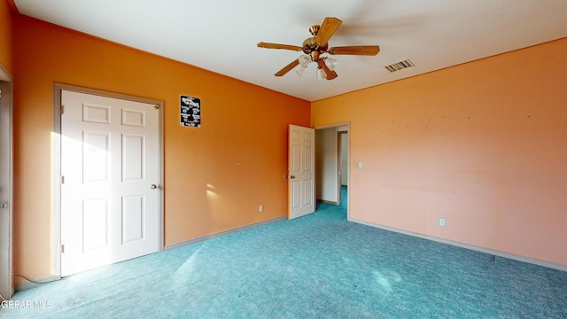 unfurnished bedroom featuring ceiling fan and light colored carpet