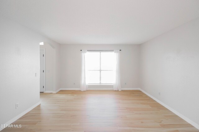 unfurnished room featuring light hardwood / wood-style floors