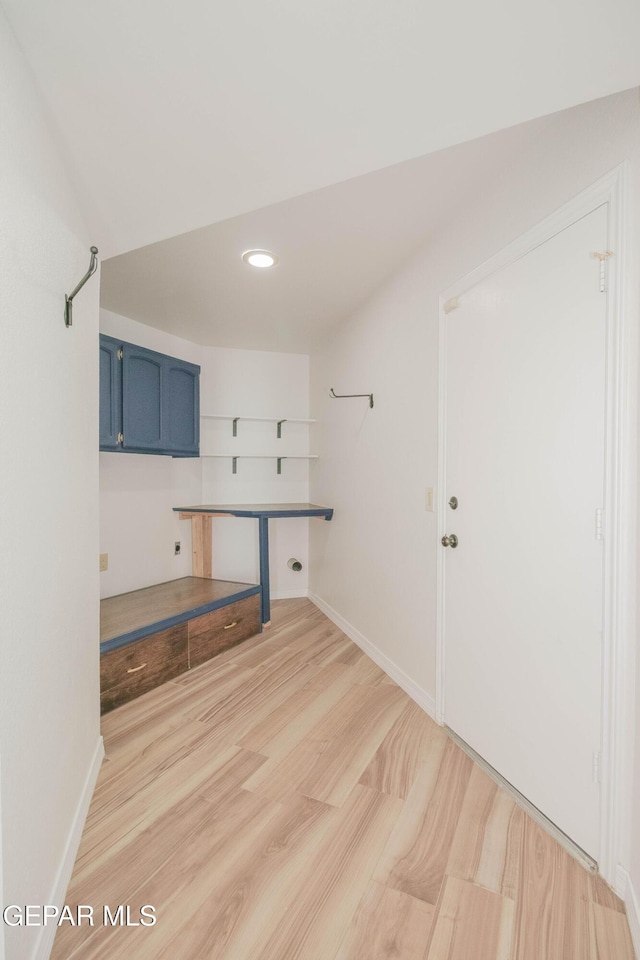 laundry room featuring light hardwood / wood-style flooring