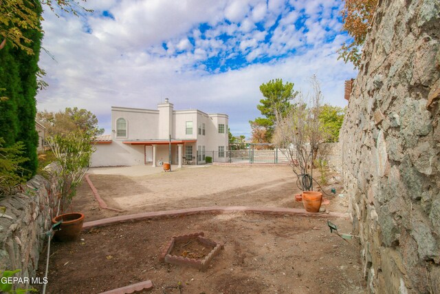 back of property featuring a patio area