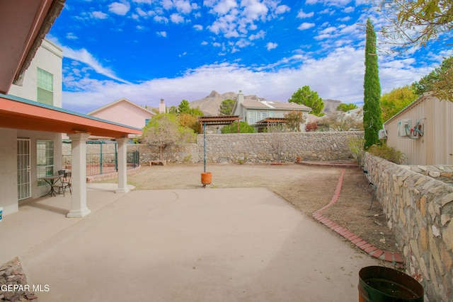 view of patio / terrace featuring a mountain view