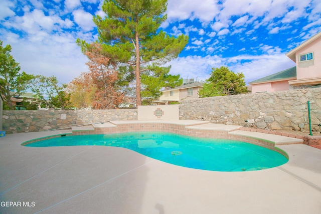 view of pool featuring a patio