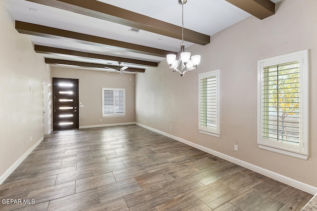 spare room with beamed ceiling, wood-type flooring, and ceiling fan with notable chandelier