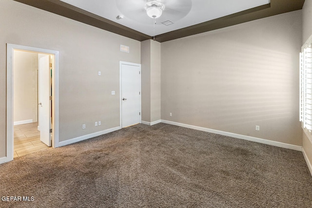 unfurnished room featuring carpet and ceiling fan