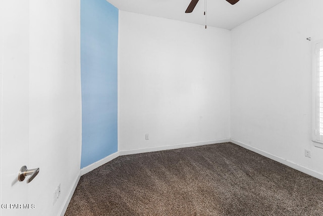 carpeted spare room featuring ceiling fan and plenty of natural light