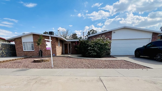 single story home with a garage