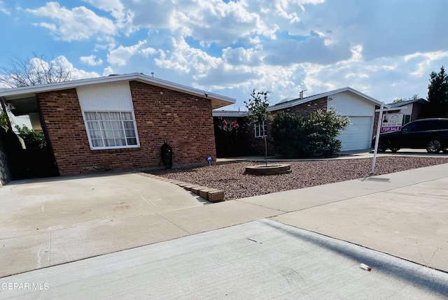 ranch-style home with a garage