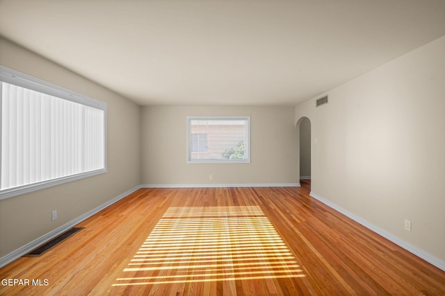 spare room with light hardwood / wood-style flooring