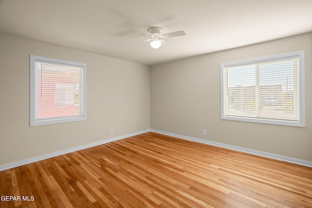 unfurnished room featuring ceiling fan and light wood-type flooring