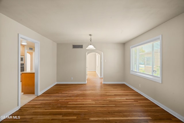 unfurnished room featuring wood-type flooring