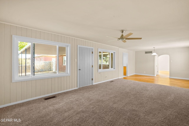 spare room with light hardwood / wood-style floors, plenty of natural light, and ceiling fan