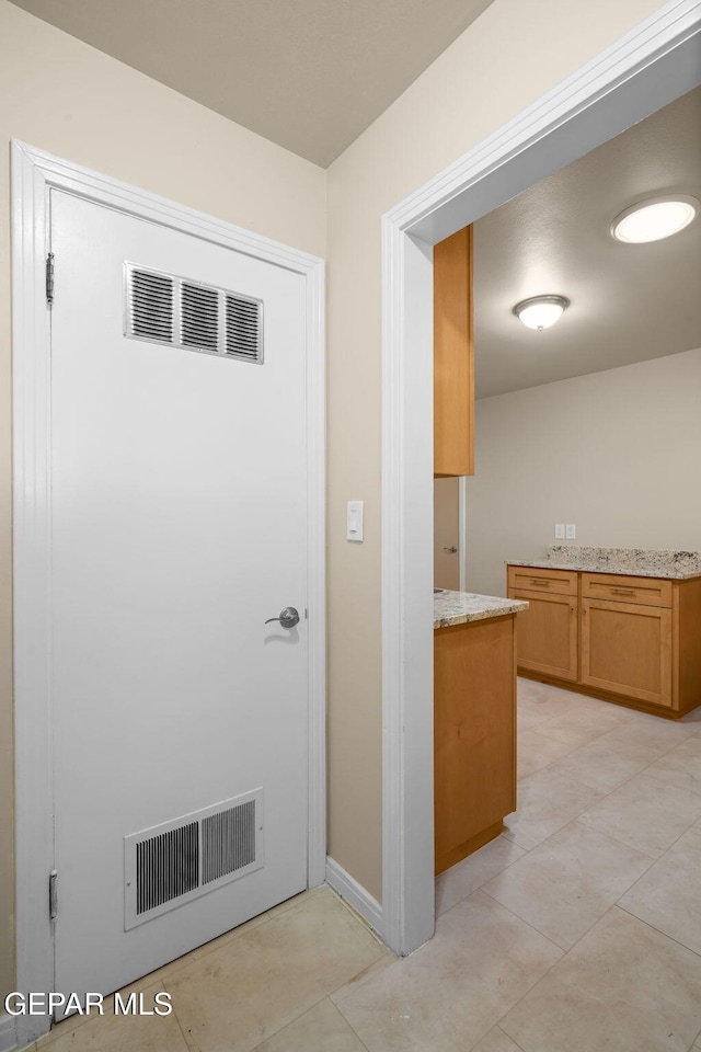 interior space with light tile patterned floors