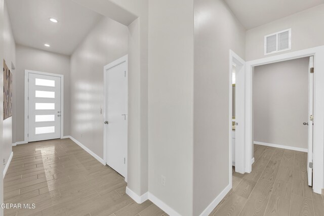 foyer with light hardwood / wood-style floors