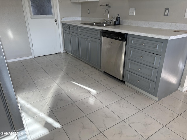 2149 Octubre Dr, El Paso, TX 79935 - kitchen with gray cabinets, dishwasher, a sink, light countertops, and marble finish floor