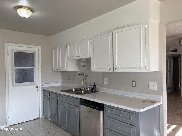 2149 Octubre Dr, El Paso, TX 79935 - kitchen with white cabinets, a sink, light countertops, gray cabinets, and stainless steel dishwasher