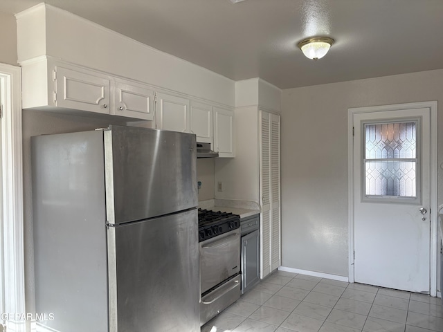 2149 Octubre Dr, El Paso, TX 79935 - kitchen featuring appliances with stainless steel finishes, light countertops, baseboards, white cabinets, and under cabinet range hood