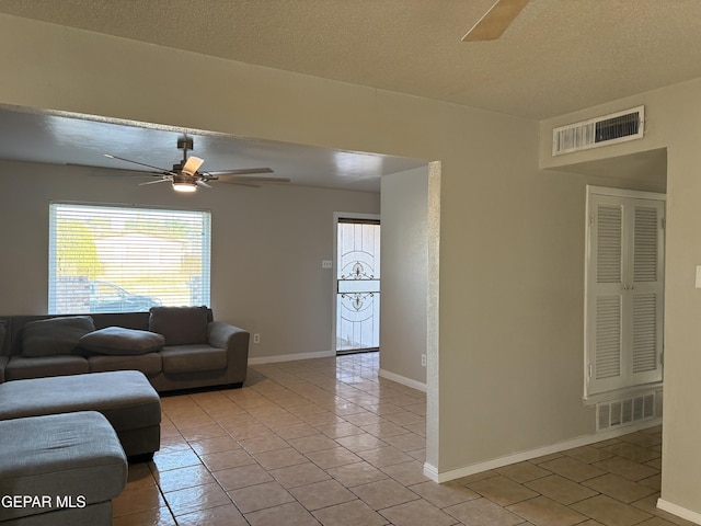 2149 Octubre Dr, El Paso, TX 79935 - living room featuring light tile patterned floors, a ceiling fan, and visible vents